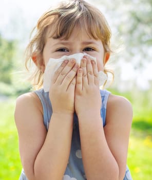 child allergic to flowering trees. Selective focus. kid.
