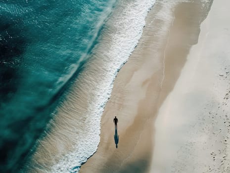 A solitary figure walks along a serene beach at sunrise. Gentle waves wash up on soft sand, creating a peaceful atmosphere as the sun begins to rise, highlighting the calm ocean.