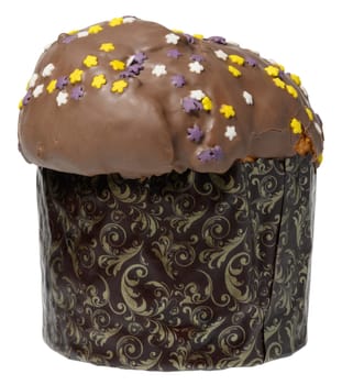 A traditional Easter sweet bread, topped with chocolate glaze and colorful star shaped sprinkles, in a decorative paper form, isolated background
