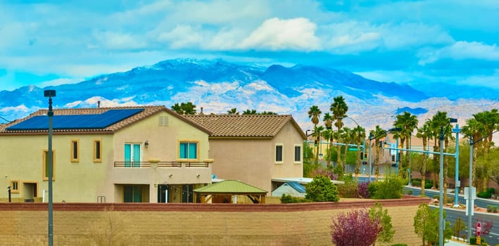 Modern suburban oasis in Las Vegas with solar-powered home, lush landscaping, and stunning Mt Charleston backdrop. Ideal for lifestyle and sustainability themes.