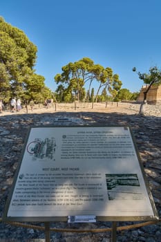 Crete.Greece - april 24, 2025: Official historical plaque at Knossos, detailing the architectural structures and ancient pathways with precise explanations, maps, and references.