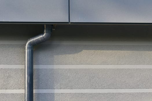 the draining away of water or substances carried in it, from the surface of an area of land