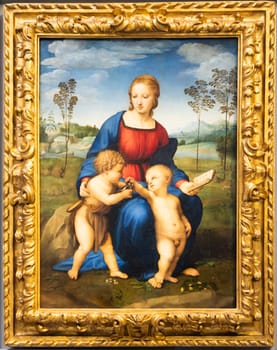 Florence, Italy - June 2022: Madonna and Child with Young St John the Baptist - also named Madonna of the Goldfinch, 1506, by Raffaello Sanzio. Raphael - Renaissance painting masterpiece