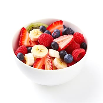 Bowl of fresh fruit salad with strawberry, blueberry, kiwi and banana on white background