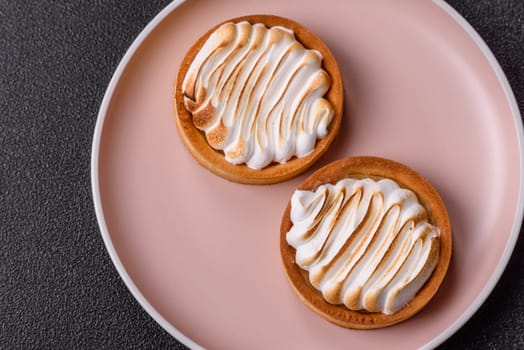 Lemon tart, meringue pie or fruit cream tart. Dessert, sweets for the morning table