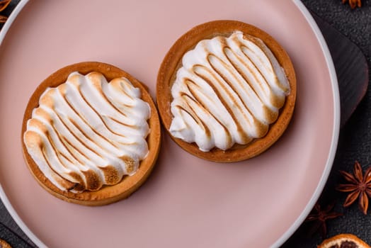 Lemon tart, meringue pie or fruit cream tart. Dessert, sweets for the morning table