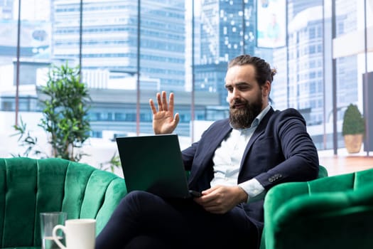 Successful male entrepreneur meeting online with his experts team, focusing on problem solving, decision making and achieving strategic objectives. Productivity for a success story.