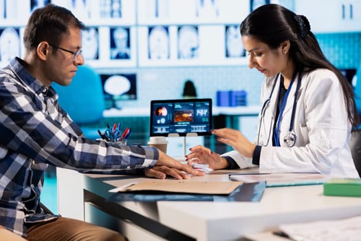 Healthcare professional uses an oximeter to measure the oxygen levels for a patient at check up, diagnostic tools for accurate medical advice. Monitoring pulse and saturation with indicator.