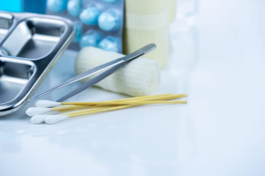 Medical equipment for treating infections. Wound care dressing set. Medical supplies for nurses. Conform bandage, forceps, cotton stick, alcohol. Sterile dressing materials. Healthcare equipment.