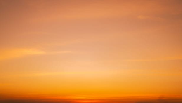 Calming orange sunset glows above peaceful horizon in summer. Peaceful sky at dusk create serene atmosphere for relaxation meditation background nature landscape scenic view summer evening tranquility