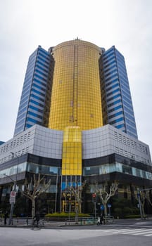 Shanghai, China - 1 April 2025: Modern Fangdi Building office tower at 201 Laoshan West Road, Pudong. Glass-and-steel high-rise with geometric architecture in Shanghai's bustling business district