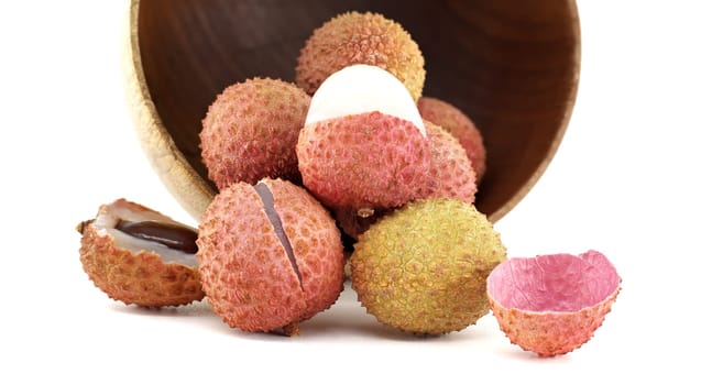 Lychee fruits displayed against a white background, highlighting their natural texture and tropical allure.