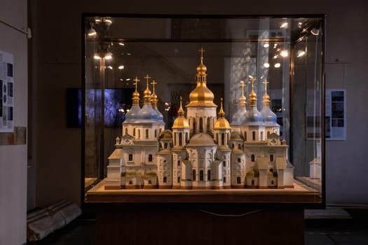 A detailed model of Saint Sophia Cathedral in Kyiv showcases its intricate design and golden domes, reflecting the rich history of this significant Orthodox landmark.