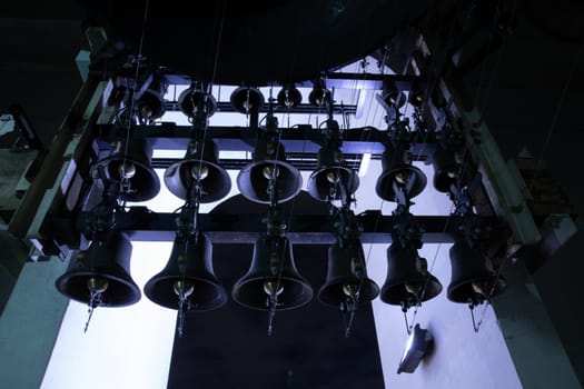 Various of bells inside of the bell tower of St. Michael's Golden-Domed Monastery at night. Orthodox Easter bells ringing. Kyiv, Ukraine.