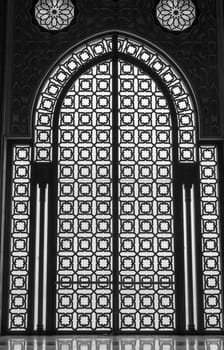 Gate silhouettes at Hassan II Mosque - Casablanca, Morocco. Vertically. 