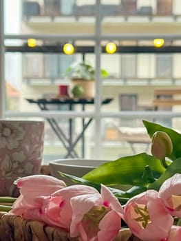 Decorative flowers in the living room in the style of boho or loft. Modern stylish interior of the house with plants in pots