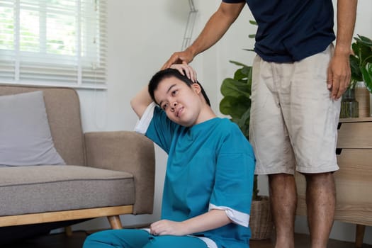 A father teaches his daughter stretching techniques, emphasizing wellness and physical health in a warm and caring environment.