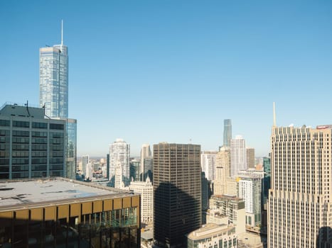 Chicago, Illinois, USA-November 9, 2023-A breathtaking aerial perspective of downtown Chicago, Illinois, captured from a tall building's window.