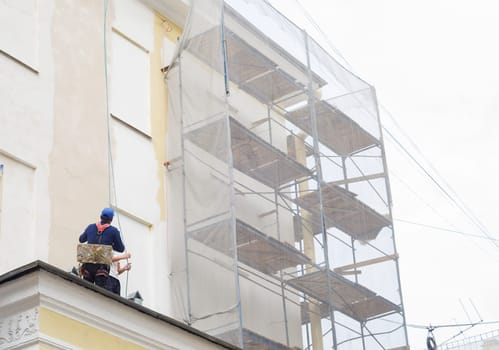 Worker at height on a building construction site
