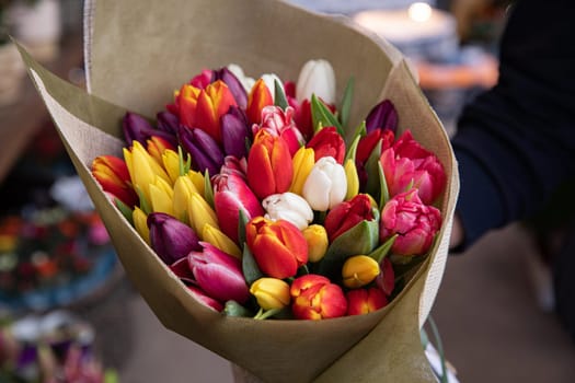 Beautiful bouquet of multi-colored tulips in a flower shop. Horizontal. Close-up.