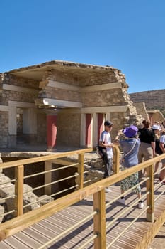 Crete.Greece - april 26, 2025: Stone structures within Knossos archaeological site reflecting the ingenuity of Minoan civilization amidst serene surroundings with historical significance.