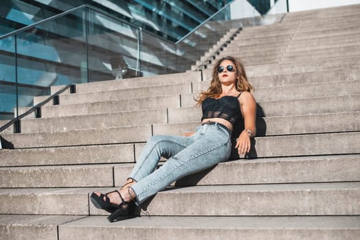 relaxed young woman enjoying sun in the city