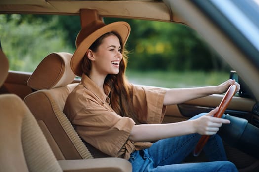 A joyful young woman smiles as she drives a vintage car, dressed in a trendy hat and relaxed clothing, surrounded by a vibrant green backdrop that evokes summer energy and a sense of adventure.