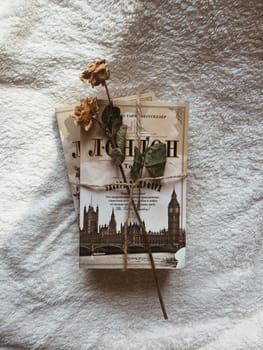 composition of a book and pink rose