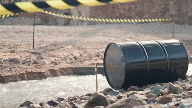 Close up of industry oil fuel tank spilling water pollution, Conserve water and Environment Issue, biohazard caution of collects sample of waste from industrial