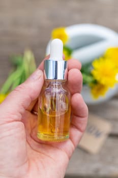 Dandelion extract and homeopathic supplements. Selective focus. nature.
