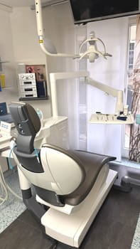 Dental chair and equipment in a contemporary clinic, featuring bright lighting and a clean environment, highlighting the importance of dental care