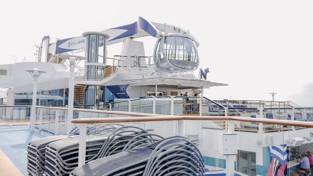 Futuristic glass sphere 360-degree views in the North Star observation capsule on the top deck of cruise ship Anthem of the Seas with a partial view of the ship s deck. New York NY USA - 09.02.2024.