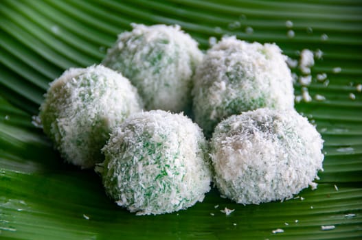 Delicious traditional onde onde with gula melaka filling and coconut coating.