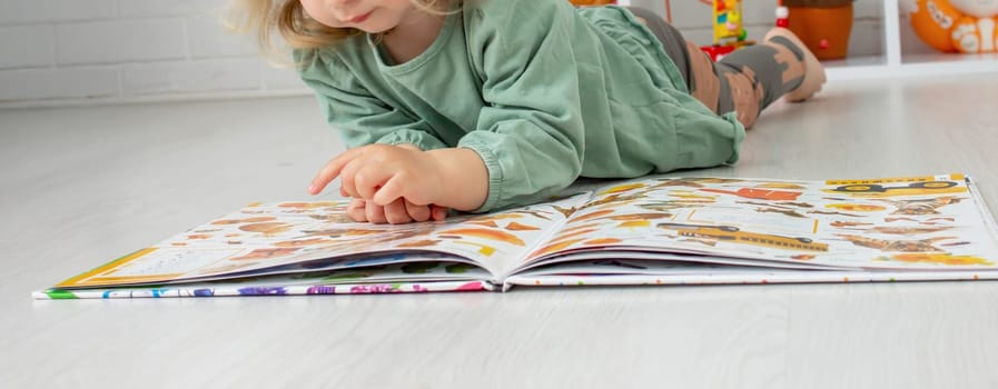 little girl reading a book. development.