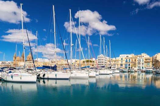 Cityscape of the Ta Xbiex bay with yachts lying on water, Malta