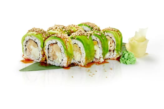 Delicious green dragon sushi rolls are presented on a white background, featuring avocado, sesame seeds, and unagi sauce, alongside wasabi and pickled ginger
