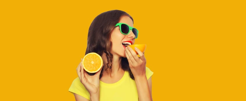 Summer, nutrition, diet and vegetarian concept. Happy healthy cheerful young woman with slices of orange fruits isolated on yellow background