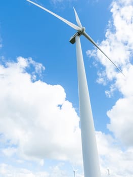 White wind turbines over rural Te Apiti hills in rural New Zealand.