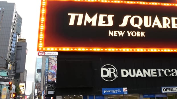 New York City, United States - 14 Sept 2023: Times Square, Manhattan Midtown Broadway street, USA. American NYC urban life. Road traffic, people pedestrians, commercial billboard screens.