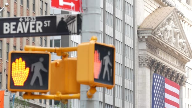 New York City, United States - 9 Sept 2023: Manhattan Downtown Financial District. American flag, Wall street. Broad and Beaver corner road sign. Stock Exchange building, USA Stock Market. Crossroad.