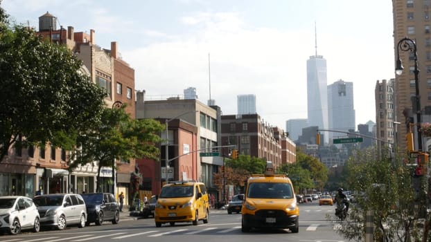 New York City, United States - 10 Sept 2023: Manhattan Greenwich Village street, Sixth 6 Americas avenue crossroad. Urban road car traffic in USA. People, zebra, yellow taxi cab. World trade center.