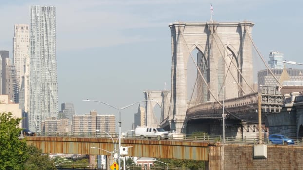 New York City, United States - 7 Sept 2023: Brooklyn Bridge to Manhattan downtown. Iconic symbol, USA travel destination. Architecture and tourist landmark. Cable-stayed bridge. Cars on elevated road.
