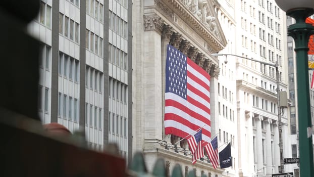 New York City, United States - 9 Sept 2023: Manhattan Downtown Financial District urban architecture. Huge big American flag. Wall street Stock Exchange building, USA Stock Market. Subway orb globe.