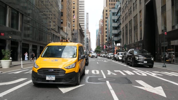 New York City, United States - 4 Sept 2023: Manhattan Midtown East 42 street, Lexington Lex avenue crossroad intersection. Urban road car traffic in USA. People, yellow taxi cab near Chrysler building