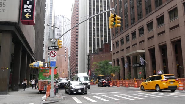 New York City, United States - 9 Sept 2023: Manhattan Downtown Financial District Water street crossroad intersection. USA NY city life. Urban road car traffic. Yellow taxi. People pedestrian, zebra.