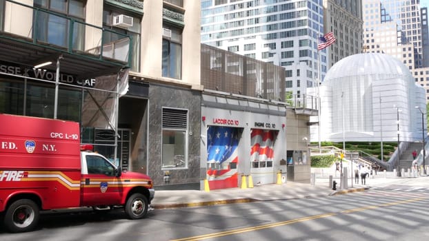 New York City, United States - 31 Aug 2023: NYFD car, USA fire department truck, american firefighters vehicle or fire fighter engine on NYC street near firemen station. FD 10 house or hall red gates.