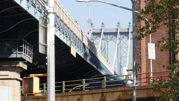 New York City, United States - 7 Sept 2023: Traffic road under Manhattan Bridge in Brooklyn. Cars on street, transport intersection in Dumbo. Vehicles below bridge on Brooklyn - Queens expressway.