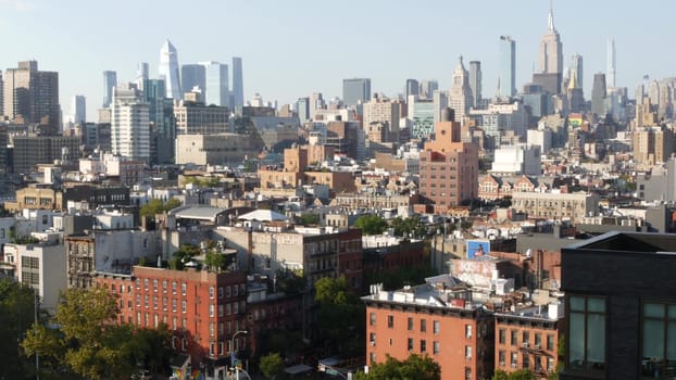 New York City, United States - 7 Sept 2023: Manhattan skyline cityscape. Empire State Building, Hudson Yards. Rooftop, residential house roof. Urban street architecture. Midtown district, East Village