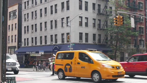 New York City, United States - 29 Aug 2023: Manhattan Midtown 34 street, Lexington Lex avenue crossroad intersection. Urban road in USA. People and cars. Traffic Control Police guard or NYPD flagger.