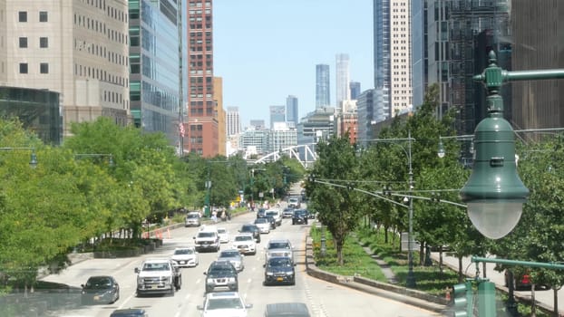 New York City, United States - 31 Aug 2023: Manhattan Downtown Financial District street crossroad intersection. Urban road car traffic. People pedestrian. World Trade Center memorial area. Skyline.